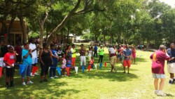 Large group of people playing outdoor games at Shady Oaks Ranch